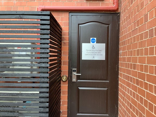 Picture of a door with bell for disabled access