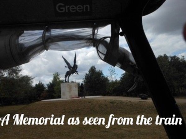 A memorial as seen from the train