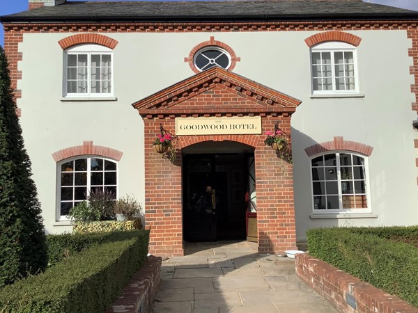 Image of a building with a door and a sign