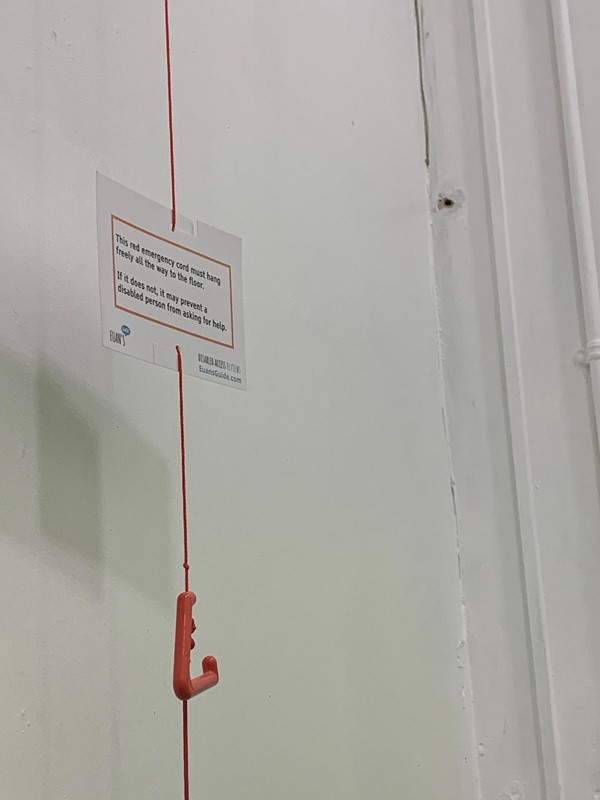 Red Cord Card on red cord in toilet