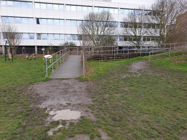 The wooden ramp used to access the south west side of the site from Riverside Bridge