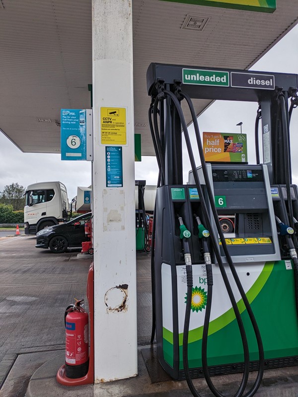 Image of a petrol station with nozzles