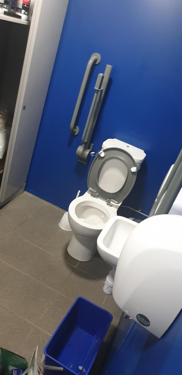 Picture of disabled toilet being used as a store cupboard