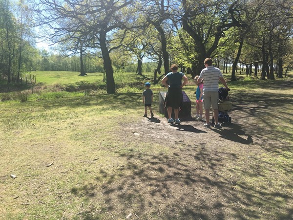 Image of family looking at one of the information boards.