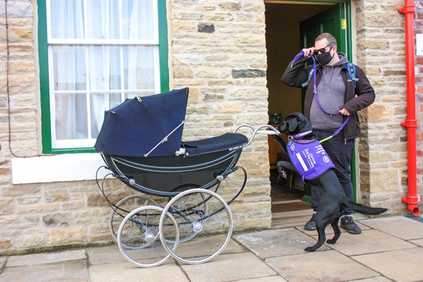 Front entry of a house with a big pram outside. Level entry into house.