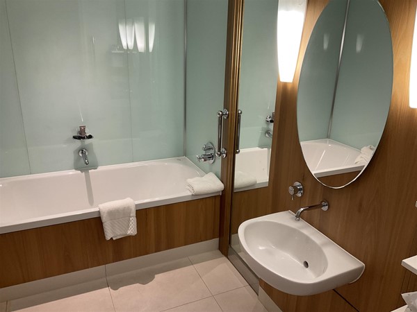 Image of a bathroom with a tub and sink