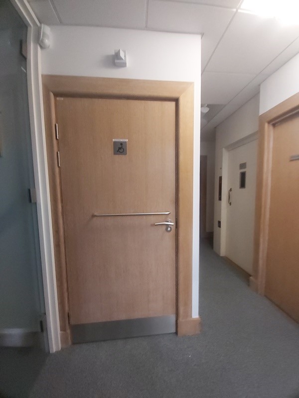 Image of an accessible toilet door
