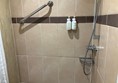 Shower in accessible room #35.  Works well if you can stand.  The hotel provided a shower chair when requested.