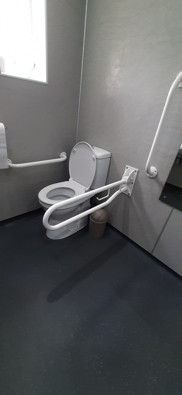 Picture of an accessible toilet with grabrails