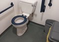 Image of a toilet with grabrails