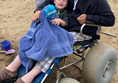 Image of a beach wheelchair user