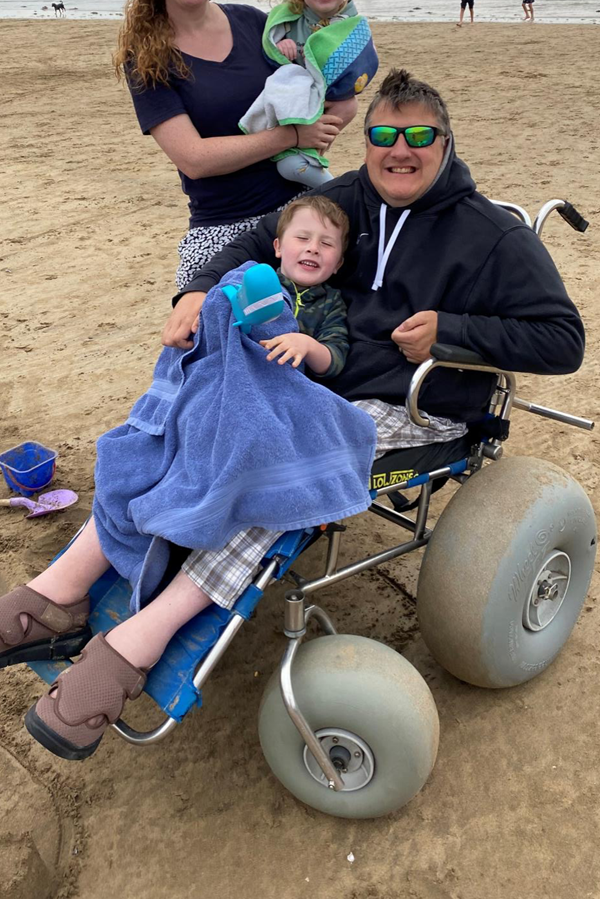 Image of a beach wheelchair user