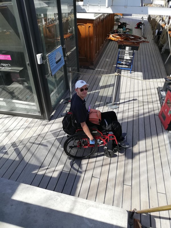 A picture taken by my partner of me from the deck that the ships wheel is set. Again it isn't accessible if you're a wheelchair user.