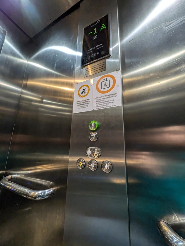 Image of lift access. The lift buttons have Braille Markings