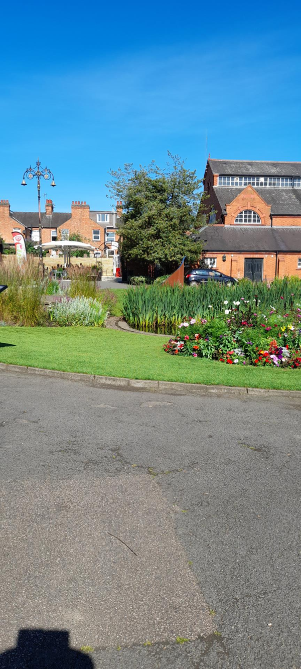 The view showing Queens Park Cafe and Charnwood Museum