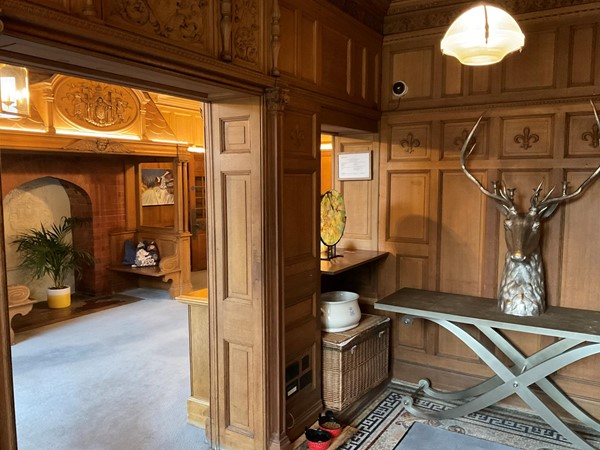 You immediately enter the old halls entrance, with its wooden panels and nicely decorated panels, which lead you to