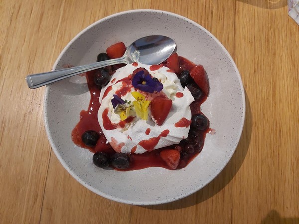 Image of a bowl of dessert with a spoon