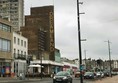 Image of a street with cars and buildings