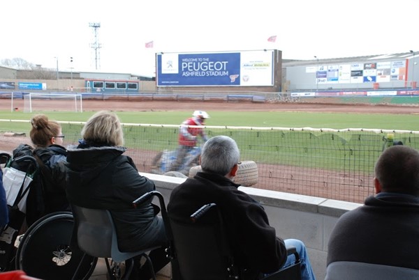 Wheelchair users watching the riders