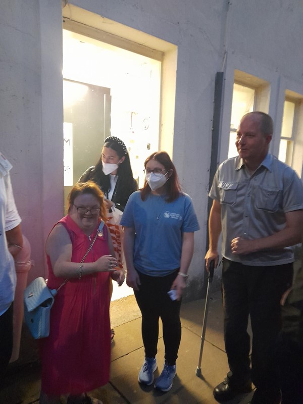 Four people standing in a street