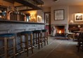 Bar area with a welcoming fire