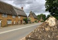 Wroxton village main A422 road as entering village from Banbury direction