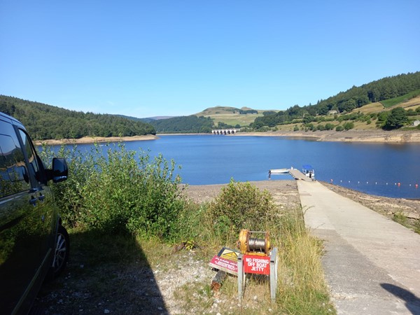 Getting to the boat. Normally the water is higher so less slope. . Don’t let the slope but you off. There are plenty of willing helpers going up and down here all day!