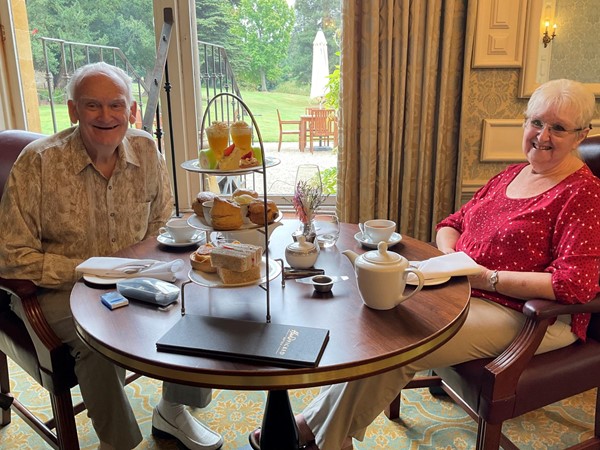 Image of two people sitting at a table