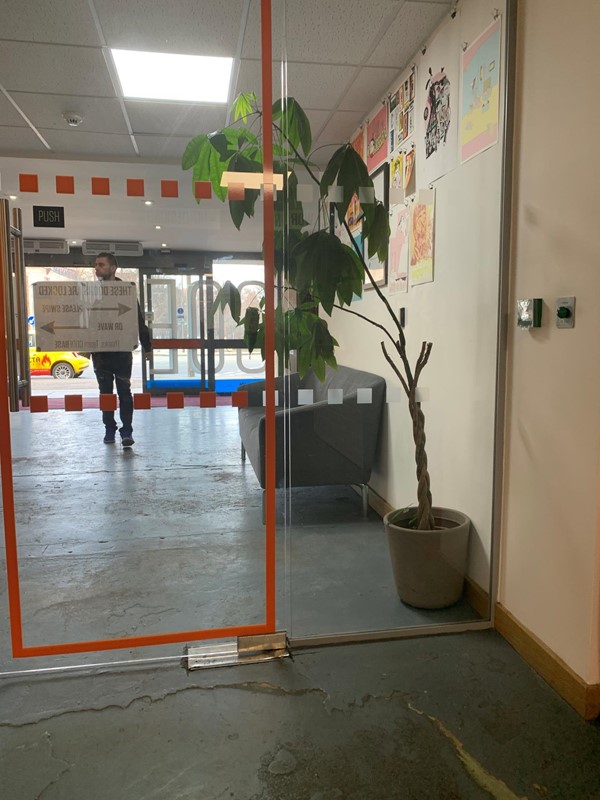 Glass door to get into main desk area