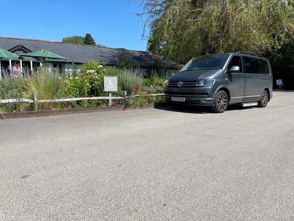 Disabled parking area by entrance on tarmac