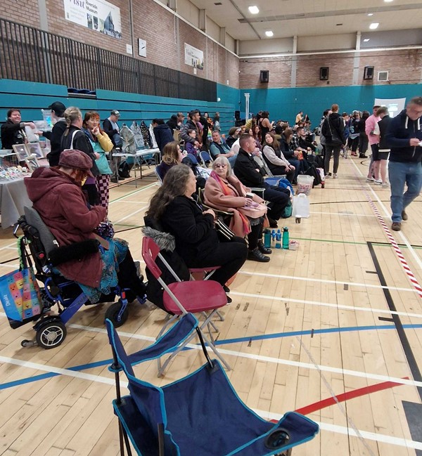 Area for spectators. Chairs available but some brought their own from home.