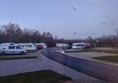 View out of motorhome window, complete with rain, showing tarmacked road and nice tidy pitches.