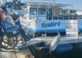 Boarding the boat, with help from Marie.