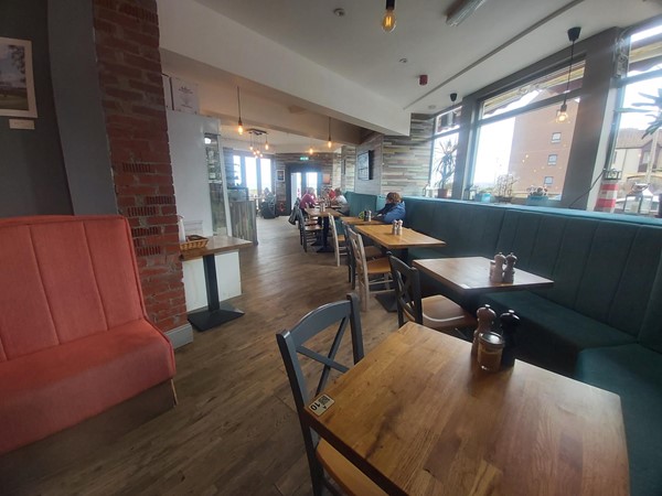 Image of a room with tables and chairs