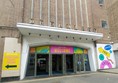 Image of a building with a welcome sign