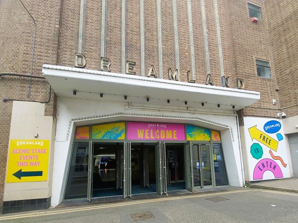 Image of a building with a welcome sign