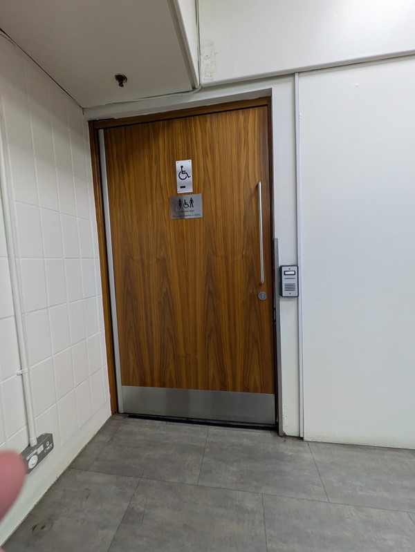 Image of the outside of the door to the accessible toilet