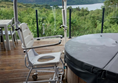 Hot tub with hoist and chair