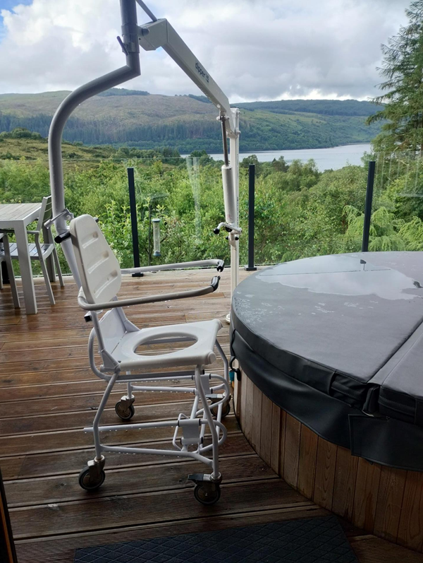 Hot tub with hoist and chair