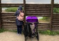 Picture of people looking through wooden bird hide