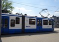 Older-style Amsterdam tram. The wheelchair accessible doors are the ones on the left of the picture.