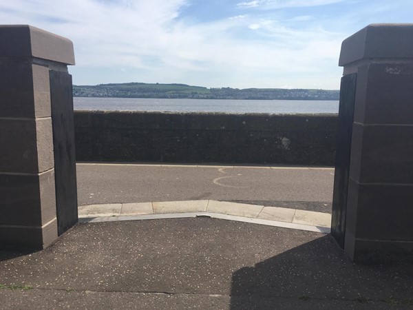 Image showing the gap in the wall to get on to the Riverside Walk pathway from the car park.