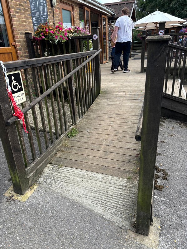 Image of a person walking down a walkway