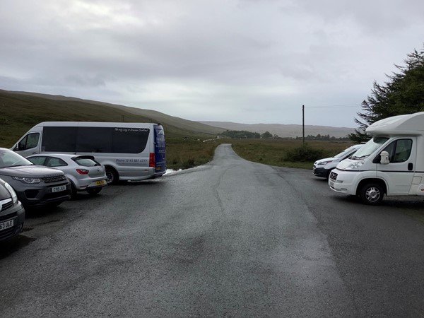 Image of a car park full of tour vans