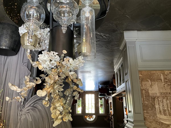 Image of a chandelier with flowers from the ceiling