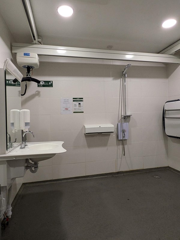 Image of the sink and ceiling track in the Changing Places toilet