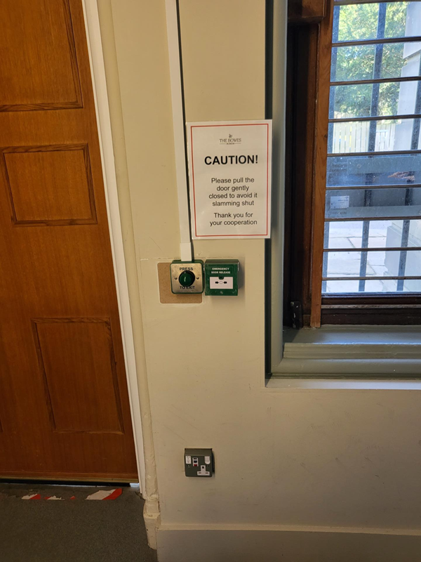 Picture of a sign advising you not to slam a door