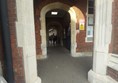 Image of an arch with a brick wall