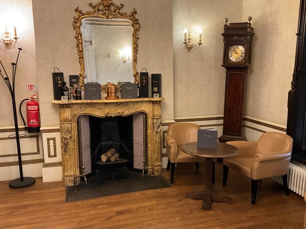 Image of a room with a fireplace and a clock