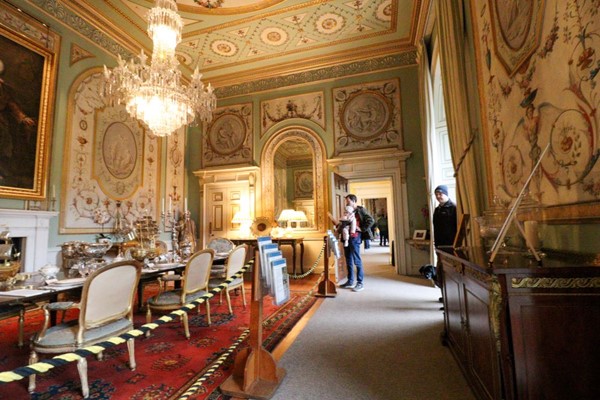 Inside the dining room with wide walkway and good lighting.